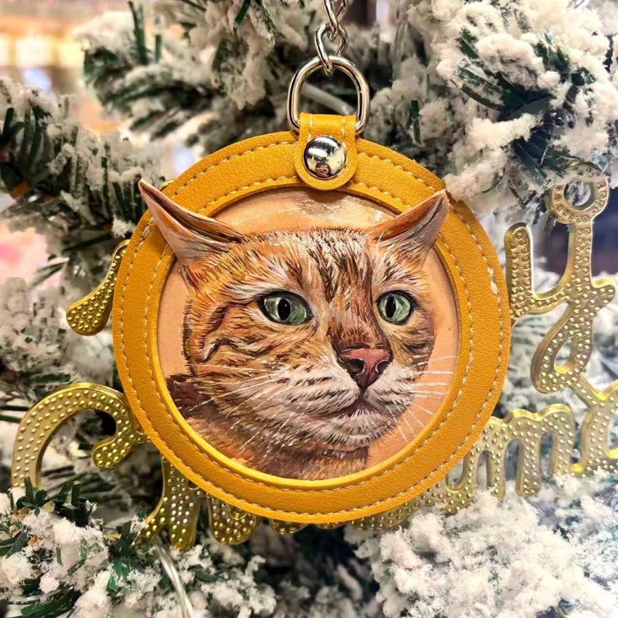 Finished custom leather cat memory charm from the same customer pet.
